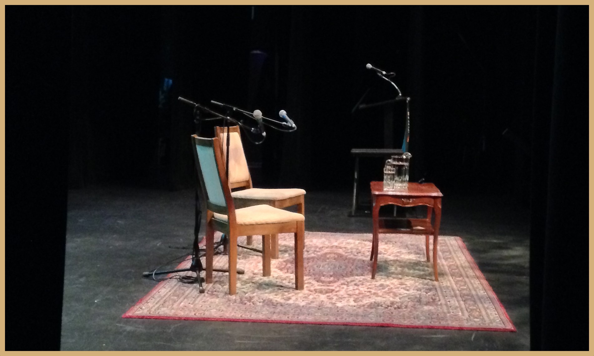 Writers Fest stage, empty chairs with mics